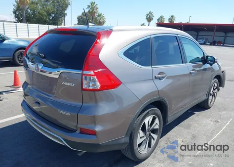 2015 Honda Cr-V Touring z USA, uszkodzony, nr VIN 5J6RM4H96FL133000